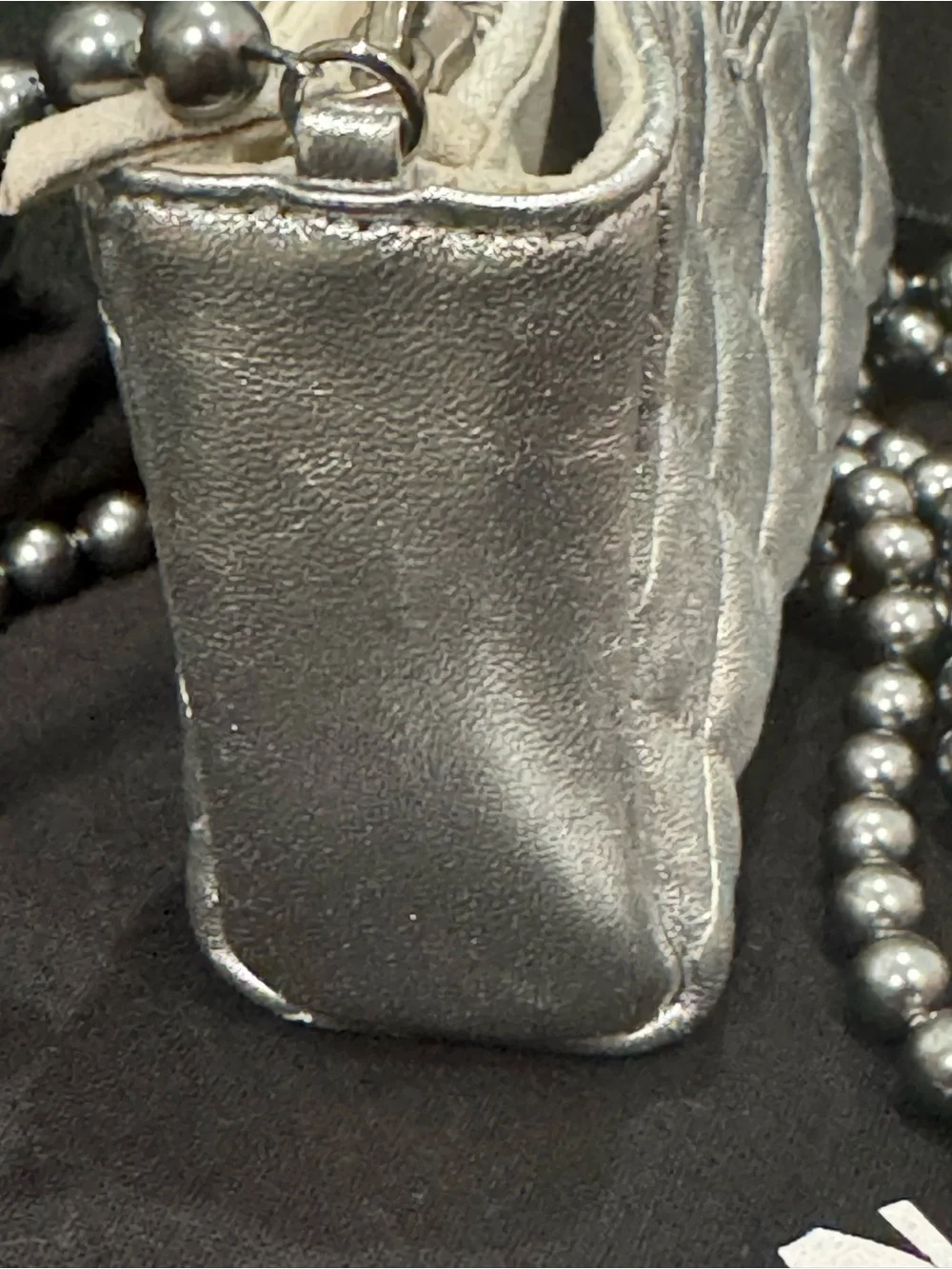 CHANEL Silver Quilted Leather O-Phone Holder with Pearl Chain.